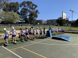 skateboarding on a basketball court at school